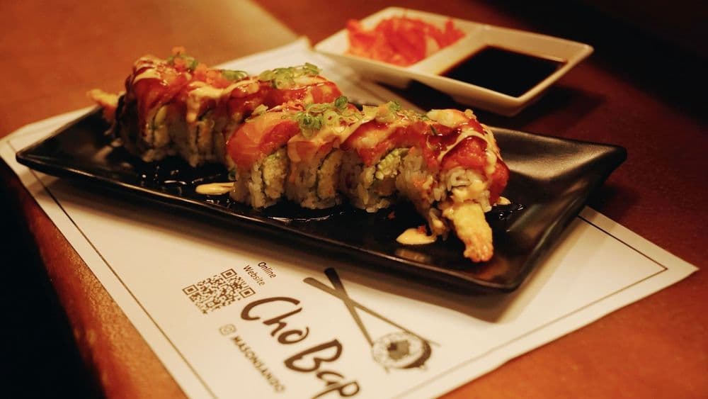 Specialty sushi roll plated tableside at Chobap